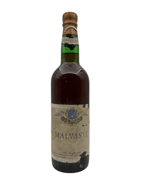 Pullo Malvasia-viiniä vuodelta 1968, jossa vanhentunut etiketti