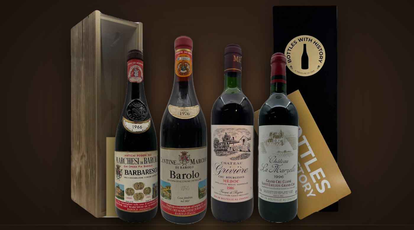 Vintage wines from 1966, 1976, 1986 and 1996 in front of Bottles With History gift boxes in wood and black